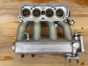 Toyota MR2 intake manifold vapour blasted by precision blasting ltd and restored